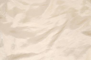 Yumuşak bej ipek kumaş arka plan. Kumaş dokusu. 