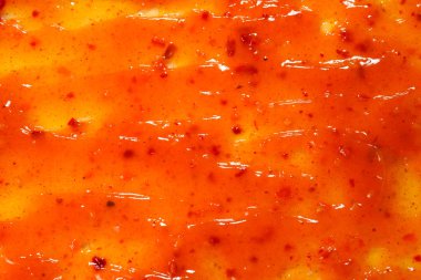 Arkaplan olarak portakal sosu sıçrar. 