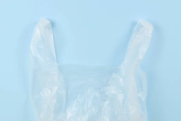 Cellophane bag on a blue background. Top view. — Stock Photo, Image