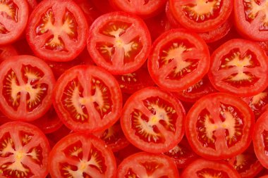 Dilimlenmiş domates arka planı. Üst görünüm. 
