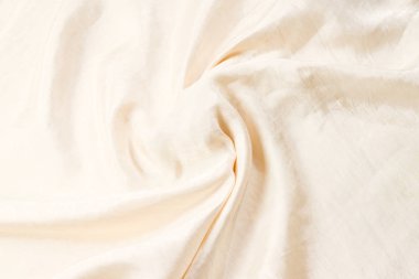 Yumuşak bej ipek kumaş arka plan. Kumaş dokusu. 