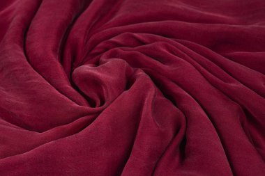 Yumuşak yumuşak bordo ipek kumaş arka plan. Kumaş dokusu. 