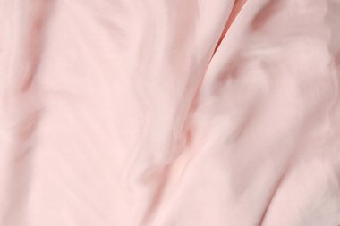 Yumuşak, pembe ipek kumaş arka plan. Kumaş dokusu. 