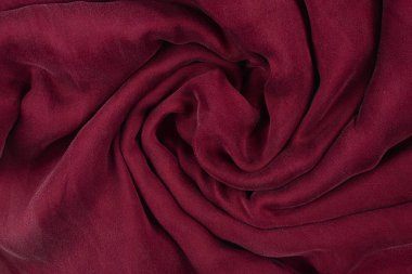 Yumuşak yumuşak bordo ipek kumaş arka plan. Kumaş dokusu. 