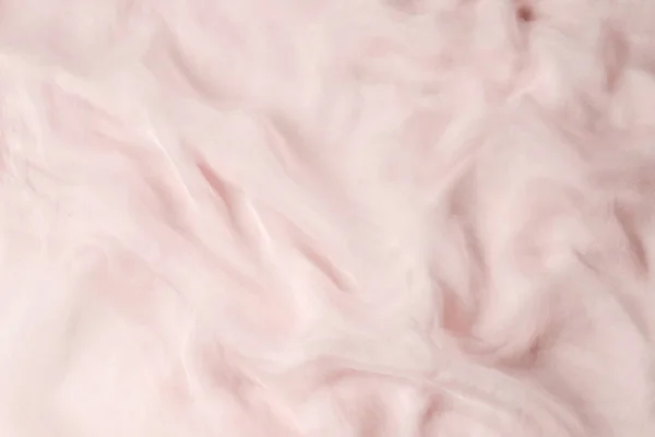 Смажьте гладкий розовый шелковый фон. Текстура ткани. — стоковое фото