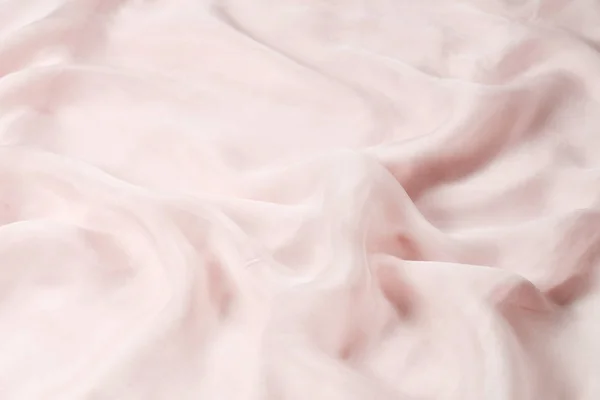 Doux fond en tissu de soie rose lisse. Texture du tissu. — Photo