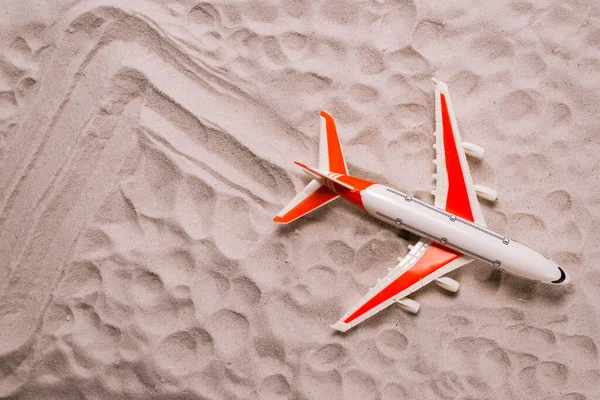 Airplane on sand. Top view. Airbus.