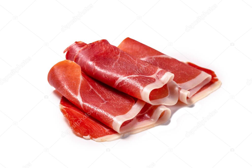 Thinly sliced jamon isolated on white background. Top view. 