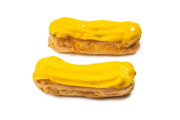 Verse Smakelijke Eclairs Witte Achtergrond Bovenaanzicht — Stockfoto