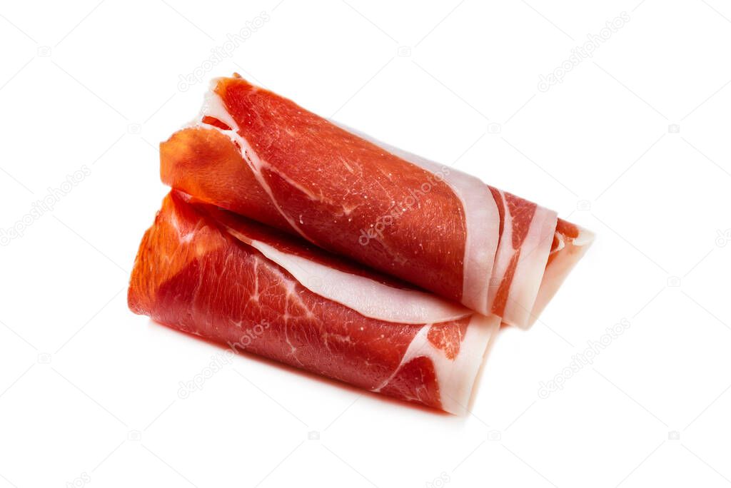 Thinly sliced jamon isolated on white background. Top view. 