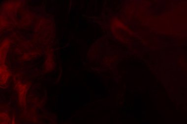 Siyah arka planda kırmızı buhar. Boşluğu kopyala.