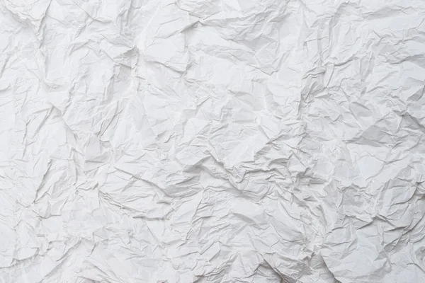 Buruşmuş beyaz kağıt arka plan. Üst görünüm. 