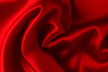 Kırmızı ipek ya da saten lüks kumaş dokusu soyut bir arka plan olarak kullanılabilir. Üst görünüm