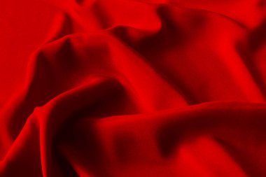 Kırmızı ipek ya da saten lüks kumaş dokusu soyut bir arka plan olarak kullanılabilir. Üst görünüm