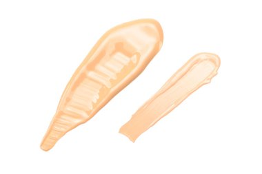 Sıvı fondöten lekesi beyaz arka planda izole edilmiş. Makyaj kremi örneğini kapat.