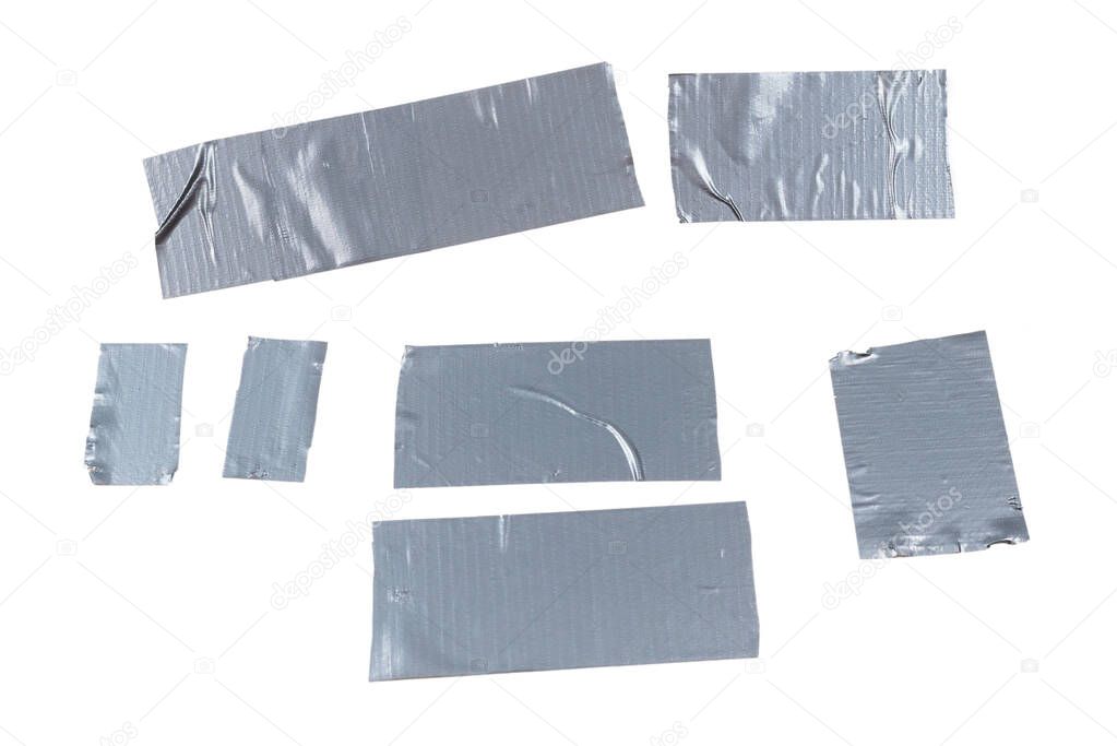 Silver scotch tape pieces isolated on white background. Top view. 