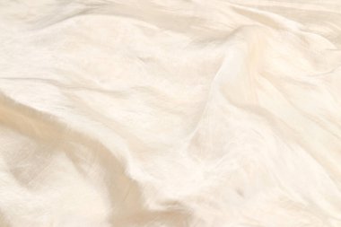 Yumuşak bej ipek kumaş arka plan. Kumaş dokusu. 