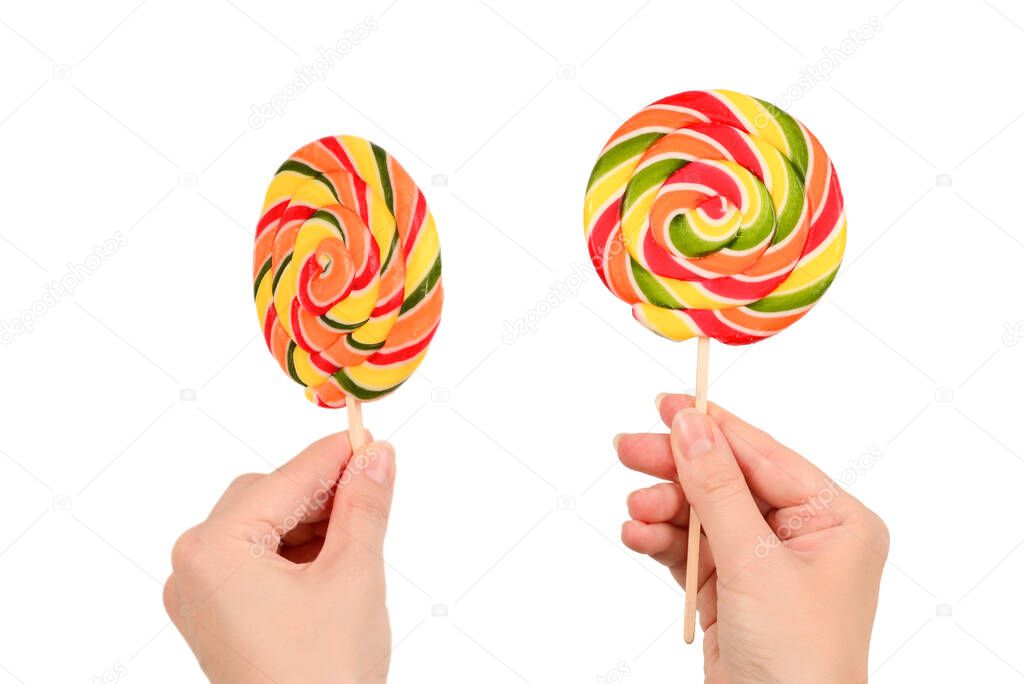 Lollipop in female hand isolated on white  background. Space for text or design.