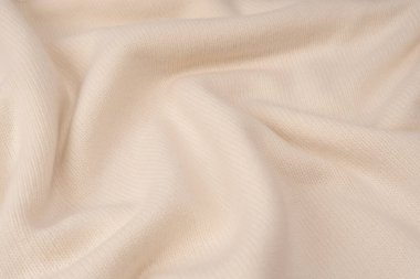 Arka plan olarak yumuşak sütlü merino yün süveter dokusu. Üst görünüm. 