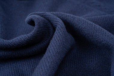 Arka plan olarak lacivert merino yün süveter dokusu. Üst görünüm. 