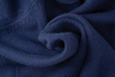 Arka plan olarak lacivert merino yün süveter dokusu. Üst görünüm. 