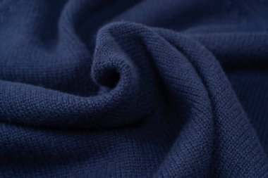 Arka plan olarak lacivert merino yün süveter dokusu. Üst görünüm. 