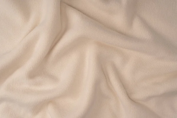 Arka plan olarak yumuşak sütlü merino yün süveter dokusu. Üst görünüm. 