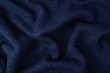 Arka plan olarak lacivert merino yün süveter dokusu. Üst görünüm. 