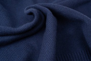 Arka plan olarak lacivert merino yün süveter dokusu. Üst görünüm. 
