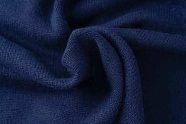 Arka plan olarak lacivert merino yün süveter dokusu. Üst görünüm. 