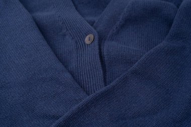 Arka plan olarak lacivert merino yün süveter dokusu. Üst görünüm. 