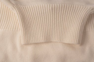 Arka plan olarak yumuşak sütlü merino yün süveter dokusu. Üst görünüm. 