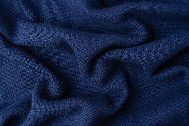 Arka plan olarak lacivert merino yün süveter dokusu. Üst görünüm. 