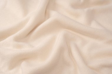 Arka plan olarak yumuşak sütlü merino yün süveter dokusu. Üst görünüm. 