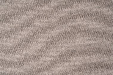 Arka plan olarak yumuşak gri merino yün süveter dokusu. Üst görünüm.