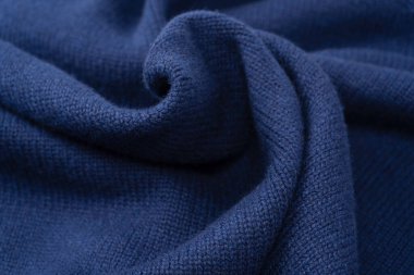 Arka plan olarak lacivert merino yün süveter dokusu. Üst görünüm. 