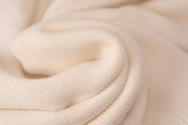 Arka plan olarak yumuşak sütlü merino yün süveter dokusu. Üst görünüm. 
