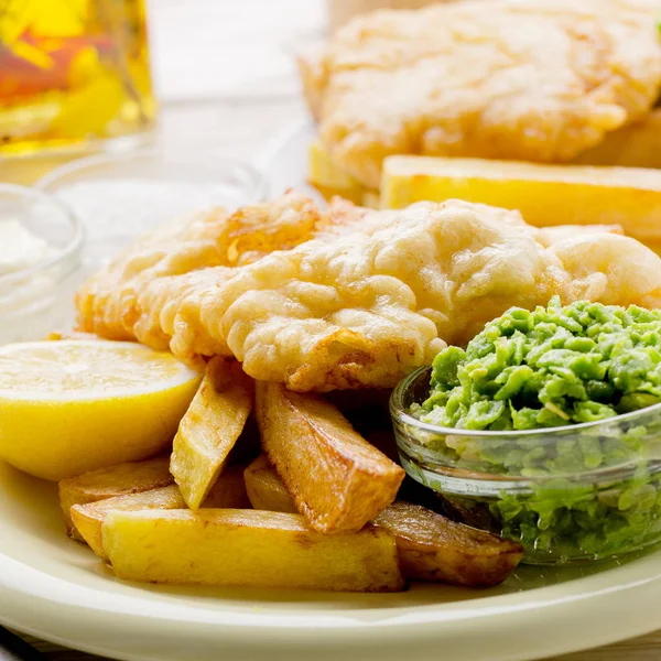 Traditional British street food fish and chips with tartar sauce