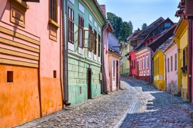 Colorful street in the medieval Sighisoara clipart