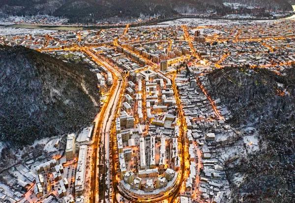 Aerial view of evening mountain city — Stock Photo, Image