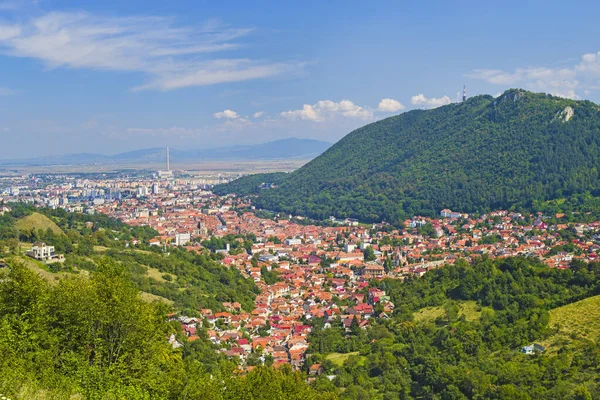 Urban aerial view of Brasov city in Romania, medieval part of the city in the foreground