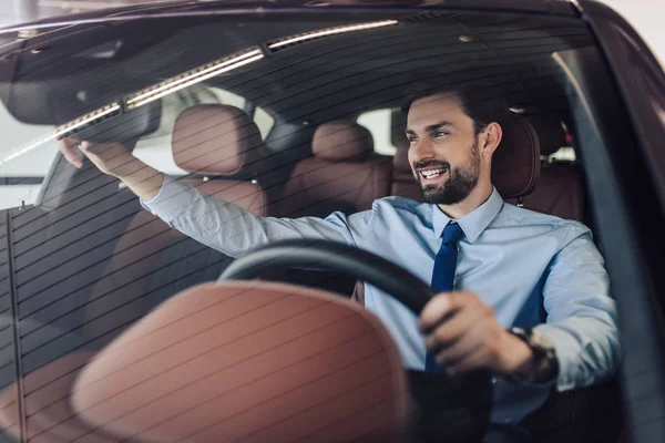 Front View Smiling Businessman Adjusting Rear View Mirror Car — Stock Photo, Image