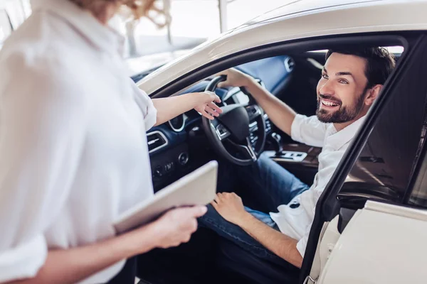 Saleswoman Talking Male Client Sitting Car Holding Digital Tablet Dealership — Stock Photo, Image