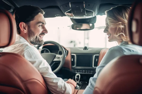 Back View Happy Couple Talking Together While Sitting New Car — стоковое фото