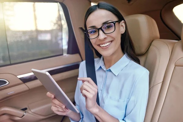 Portrait Smiling Businesswoman Using Digital Tablet Sitting Car Looking Camera — Stockfoto