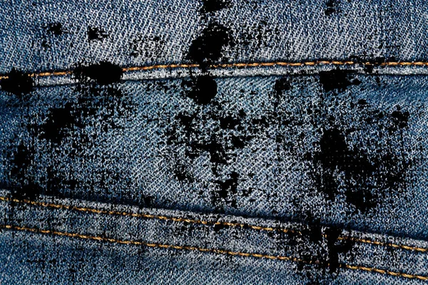 Eskimiş mavi kot pantolonların Grunge kirli kapanışı Denim dokusu, web sitesi veya mobil aygıtlar için makro arkaplan