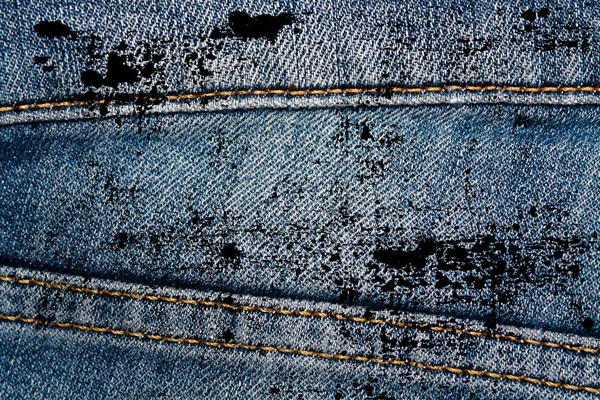 Eskimiş mavi kot pantolonların Grunge kirli kapanışı Denim dokusu, web sitesi veya mobil aygıtlar için makro arkaplan