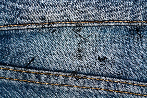 Eskimiş mavi kot pantolonların Grunge kirli kapanışı Denim dokusu, web sitesi veya mobil aygıtlar için makro arkaplan