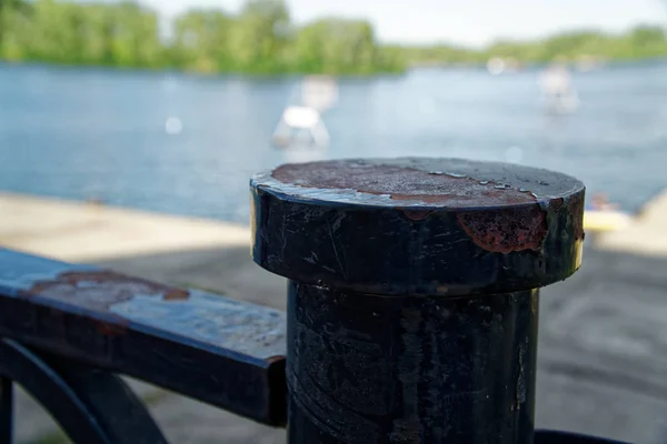 Steel fence in public park, defocused background, near the river — Stock Photo, Image