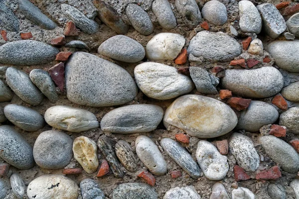 Kieselsteine alten Wandhintergrund, Nahaufnahme große Steine. — Stockfoto